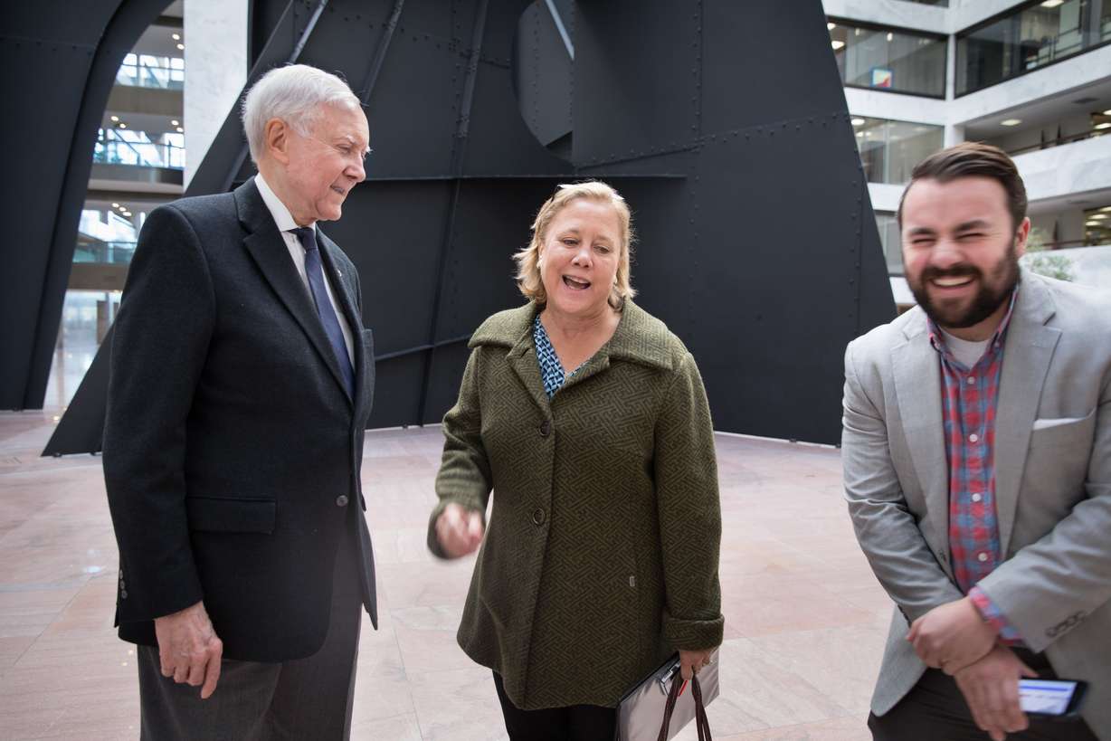 Former Louisiana Sen. Mary Landrieu, center, jokes with Utah Sen. Orrin Hatch, left, and Matt Whitlock, Hatch's spokesman, on Oct. 22, 2018.