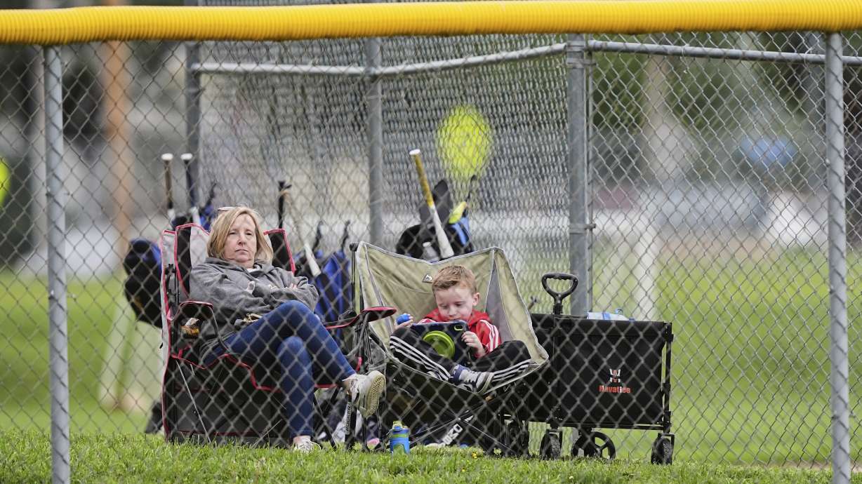 Karli Casamento, watches of her 15-year-old son, Jax's youth baseball game with her son seven-year-old Colt in Aston, Pa., Tuesday, May 27, 2025.