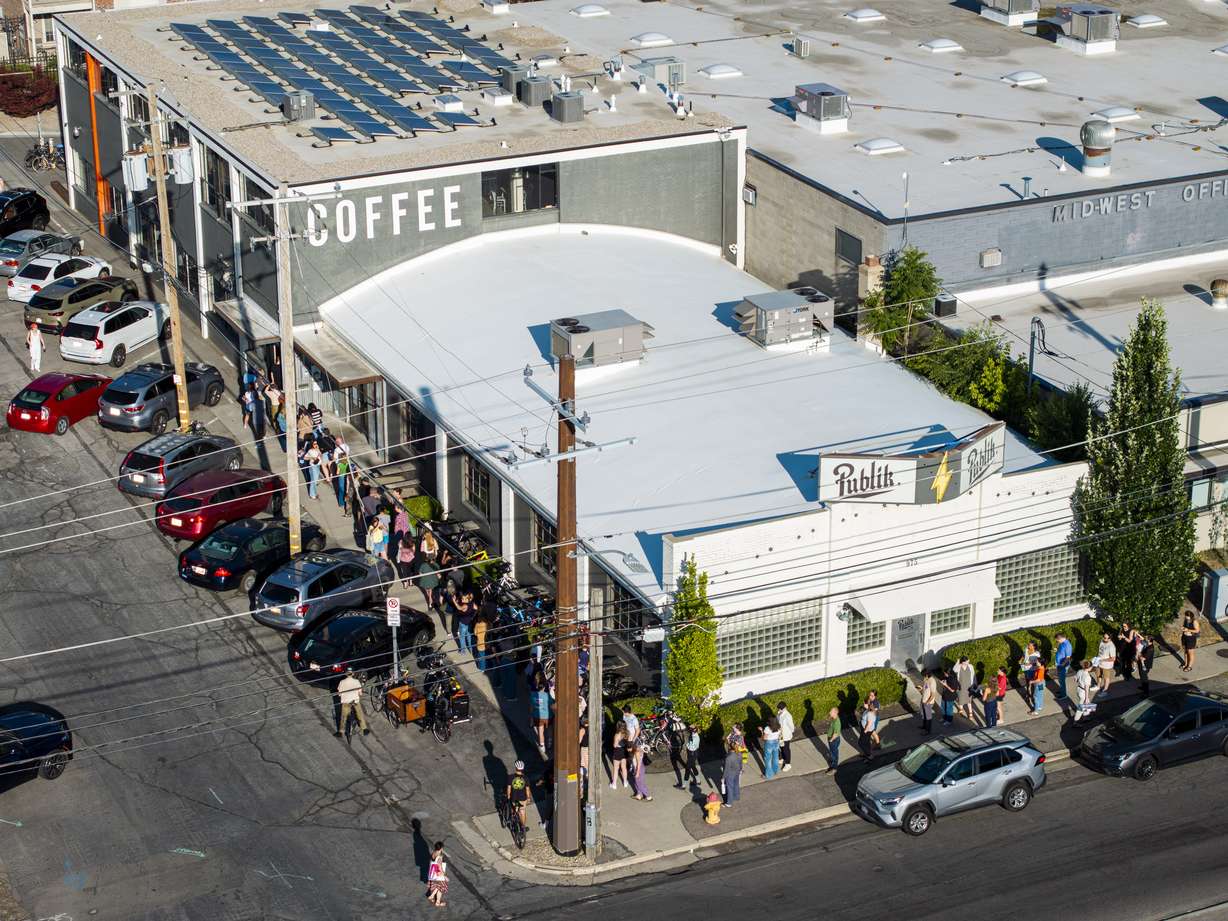 People wait to enter Publik Coffee Roasters in Salt Lake City during a letter-writing event to hold Sen. Mike Lee, R-Utah, accountable, hosted by the Alliance for a Better Utah and Elevate Utah on Wednesday.