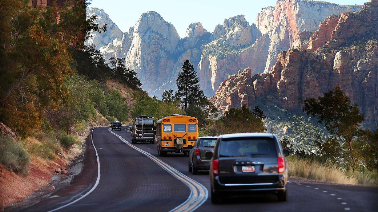Vehicles travel through Zion National Park on Oct. 14, 2020.