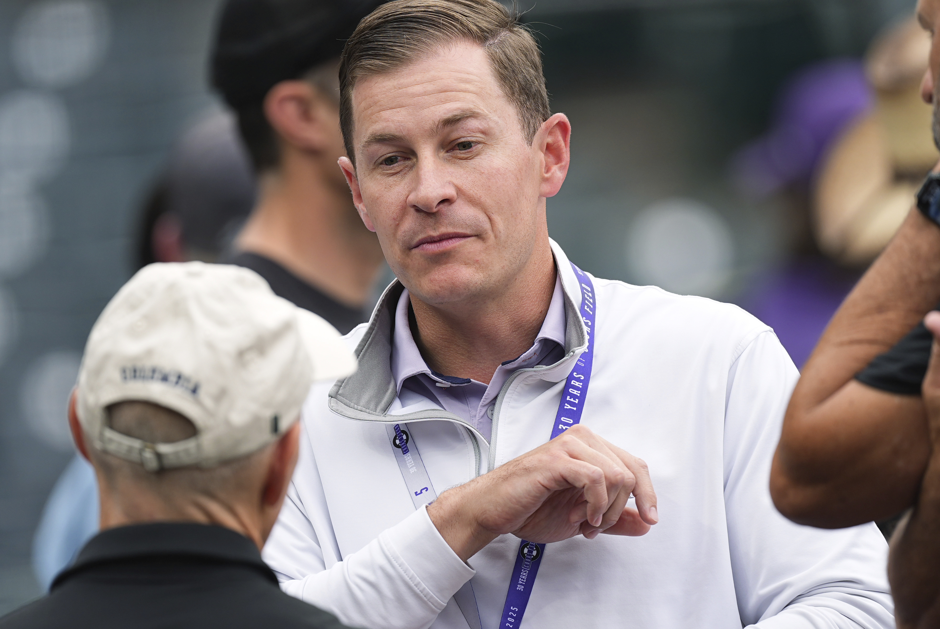Walker Monfort, who was named as executive vice president of the Colorado Rockies Thursday, June 25, 2025, and will assume the role of president and chief operating officer at season's end, talks to fans before a baseball game Wednesday, June 25, 2025, in Denver. 