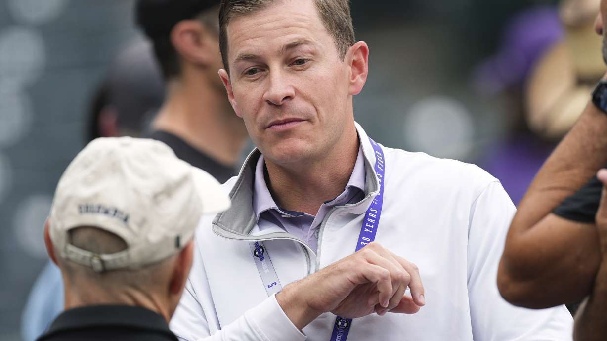 Walker Monfort, who was named as executive vice president of the Colorado Rockies Thursday, June 25, 2025, and will assume the role of president and chief operating officer at season's end, talks to fans before a baseball game Wednesday, June 25, 2025, in Denver.