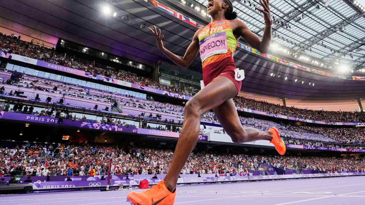 FILE - Faith Kipyegon, of Kenya, celebrates after winning the women's 1500-meter final at the 2024 Summer Olympics, Saturday, Aug. 10, 2024, in Saint-Denis, France.