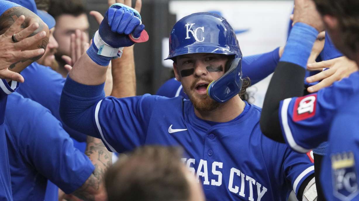 Kansas City Royals' Bobby Witt Jr. celebrates with teammates after hitting a two-run home run during the ninth inning of a baseball game against the Chicago White Sox in Chicago, Sunday, June 8, 2025.