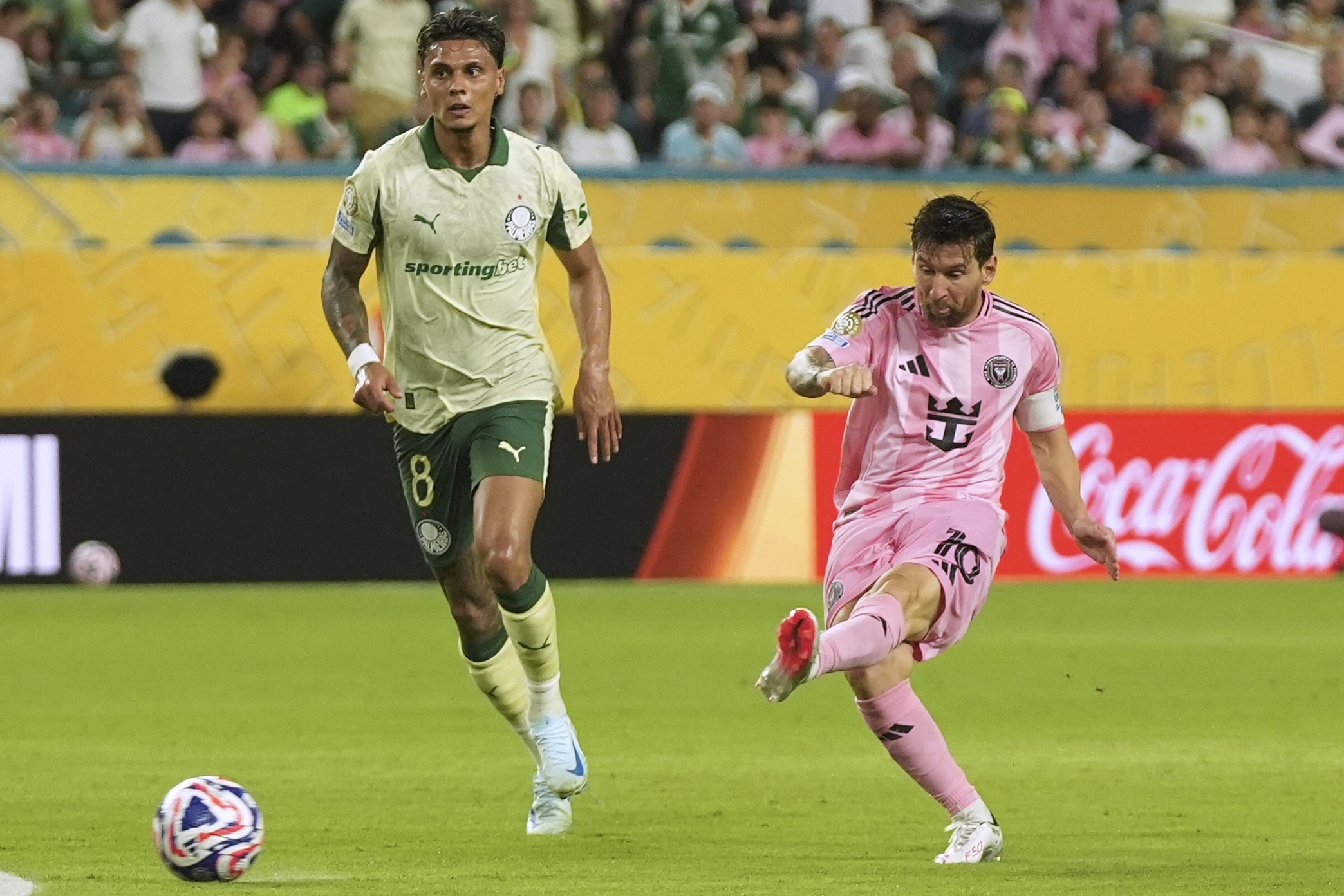 Inter Miami's Lionel Messi shoots on goal against Palmeiras' Richard Rios during the Club World Cup Group A soccer match between Inter Miami and Palmeiras in Miami Gardens, Fla., Monday, June 23, 2025. 