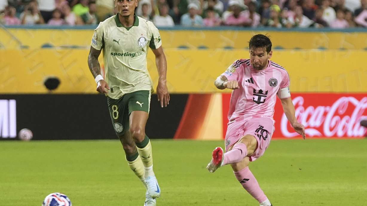 Inter Miami's Lionel Messi shoots on goal against Palmeiras' Richard Rios during the Club World Cup Group A soccer match between Inter Miami and Palmeiras in Miami Gardens, Fla., Monday, June 23, 2025.