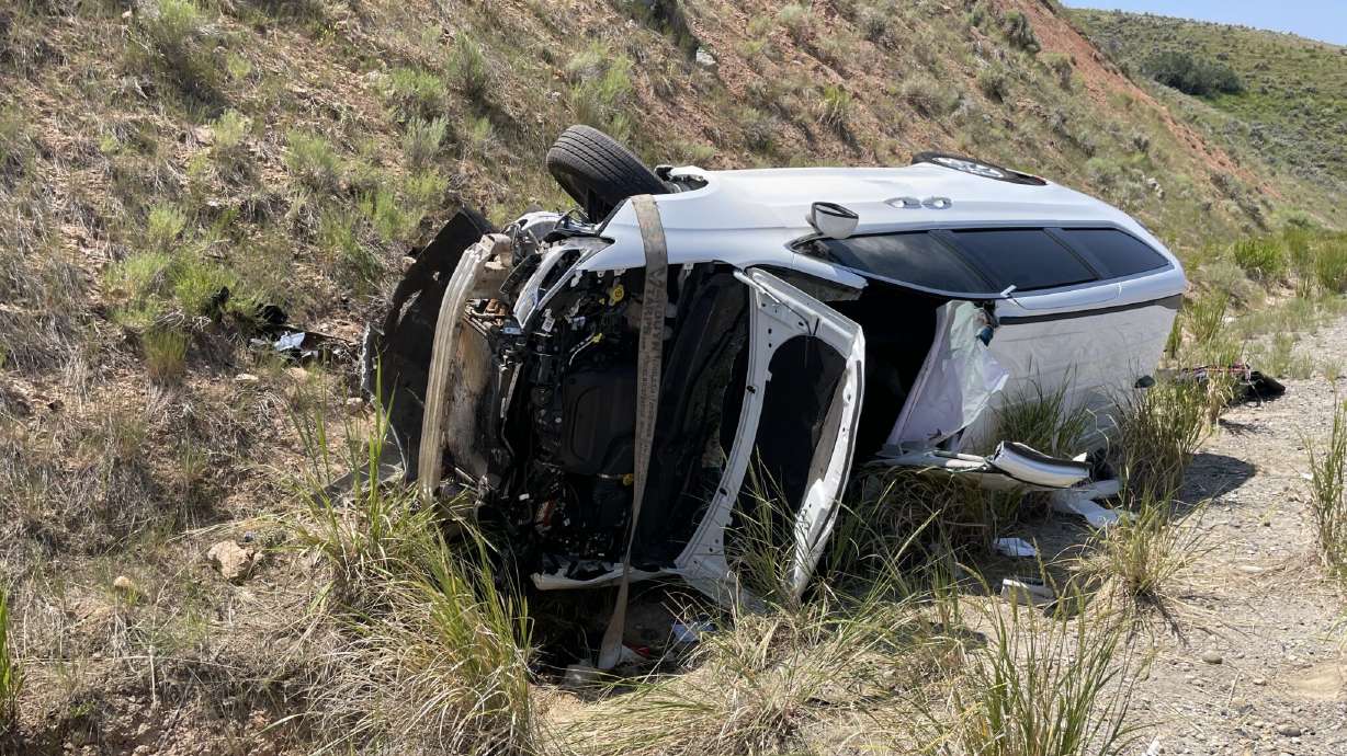 Two people were hospitalized and traffic was significantly backed up after a two-vehicle crash on I-80 near the Wyoming border Friday.
