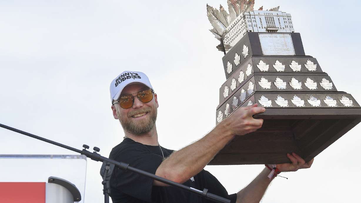 Florida Panthers' Sam Bennett holds up the Conn Smythe Trophy during the NHL hockey team's Stanley Cup championship celebration, Sunday, June 22, 2025, in Fort Lauderdale, Fla.