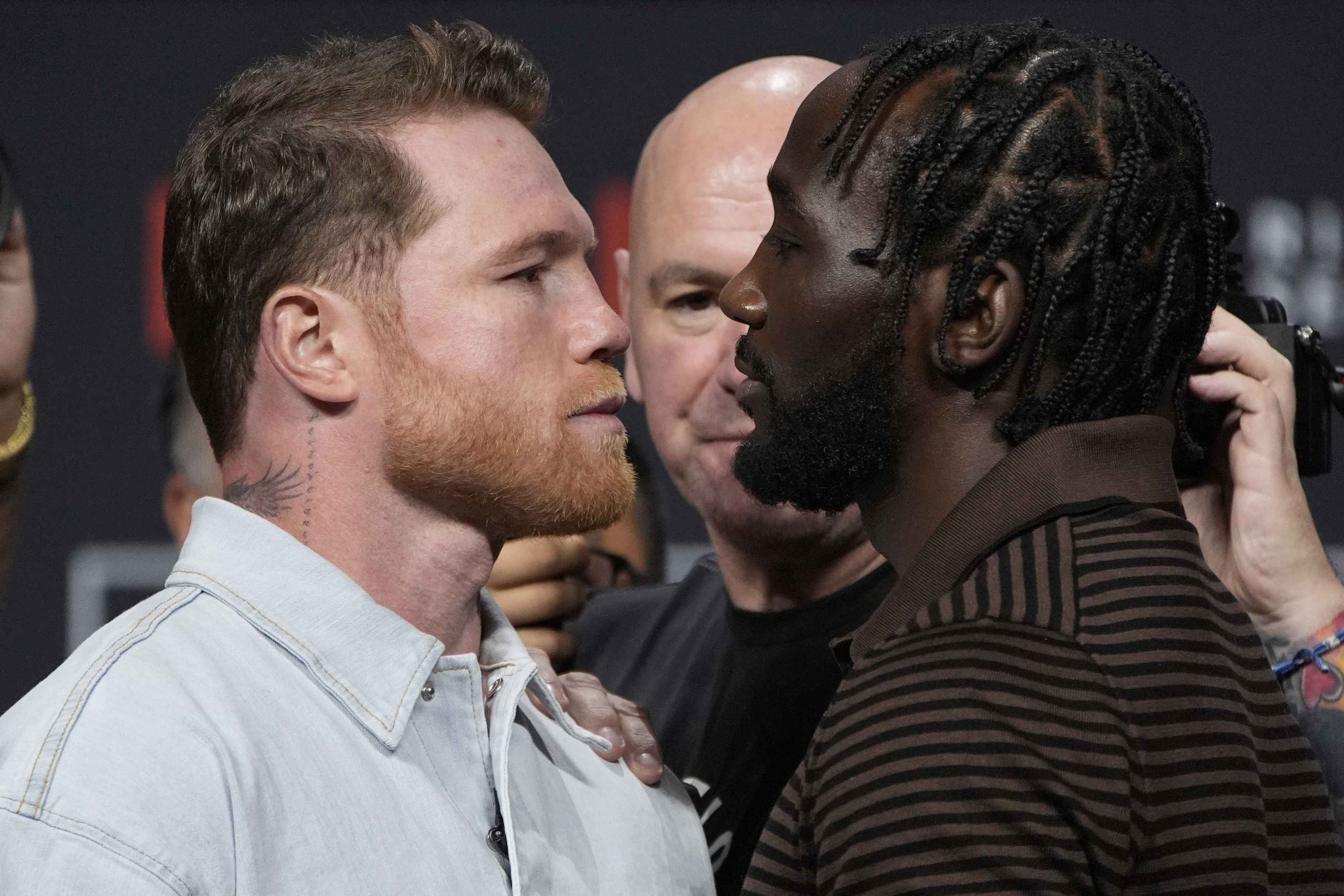 Canelo Alvarez, left, and Terence Crawford face off during a news conference for their upcoming boxing match Friday, June 27, 2025, in Las Vegas. 