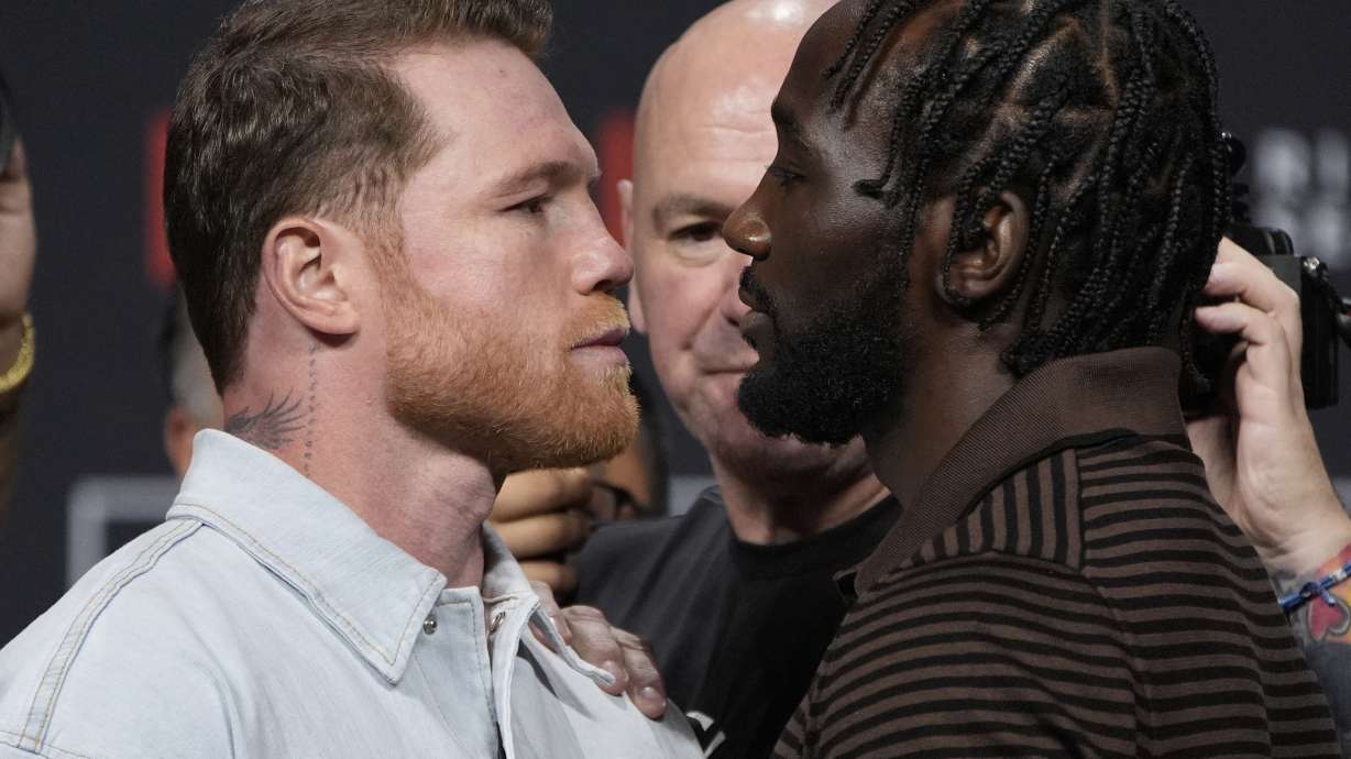 Canelo Alvarez, left, and Terence Crawford face off during a news conference for their upcoming boxing match Friday, June 27, 2025, in Las Vegas.