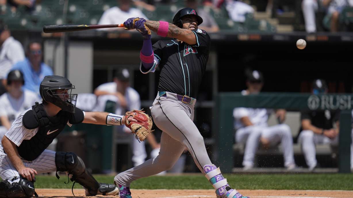 Arizona Diamondbacks' Ketel Marte (4) fouls off the ball during the first inning of a baseball game against the Chicago White Sox, Wednesday, June 25, 2025, in Chicago.