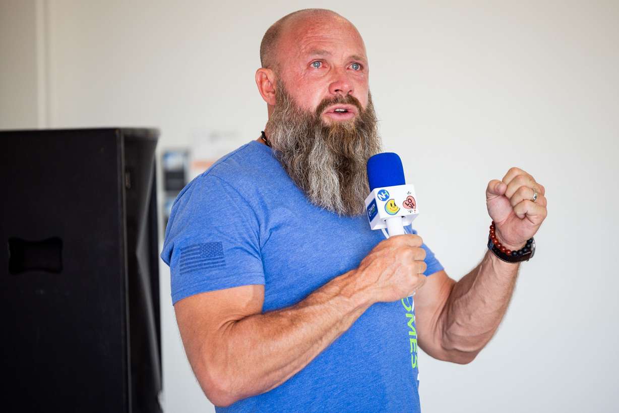 Nilson Homes owner and CEO Jed Nilson speaks at a ceremony to commemorate construction of a new home for former high school football coach Erik Thompson and his family in South Weber on Friday. Nilson said he kept coming back after he first met the Thompson family.