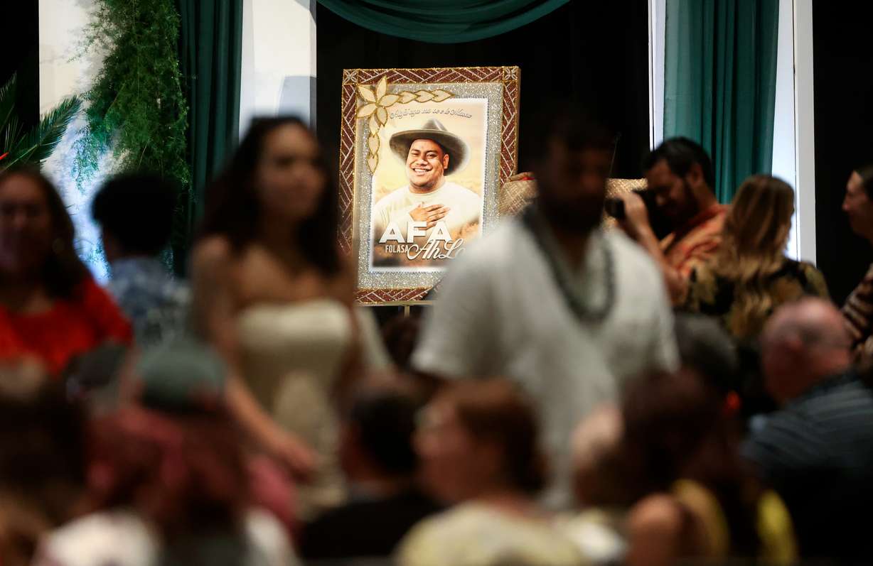 People arrive at the celebration of life for Afa Ah Loo, who was shot and killed as an innocent bystander during a No Kings protest, at the Salt Palace Convention Center in Salt Lake City on June 27.