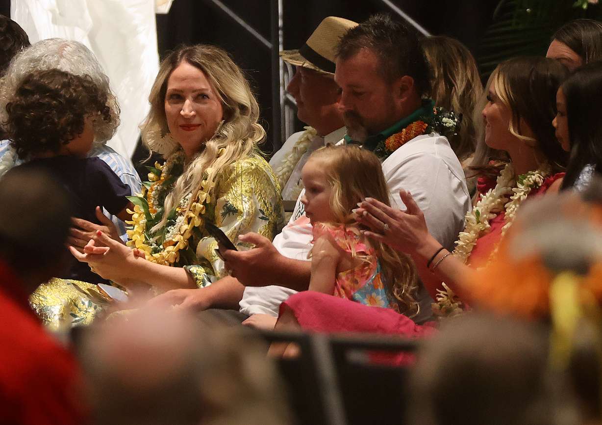 Laura Ah Loo applauds a performance at the celebration of life for her husband, Afa Ah Loo, at the Salt Palace Convention Center in Salt Lake City on June 27. Afa Ah Loo was shot and killed as an innocent bystander during a "No Kings" protest on June 14.