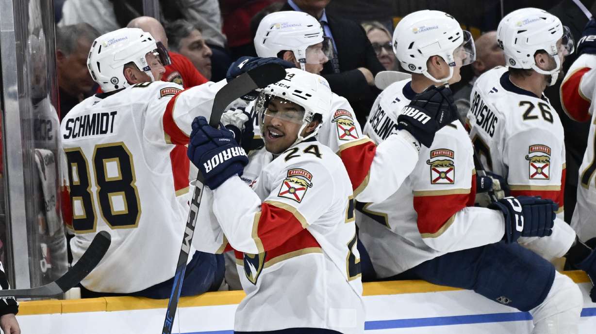 FILE - Florida Panthers right wing Justin Sourdif (24) is congratulated by defenseman Nate Schmidt (88) after scoring against the Nashville Predators during the second period of an NHL hockey game, Tuesday, Feb. 25, 2025, in Nashville, Tenn.