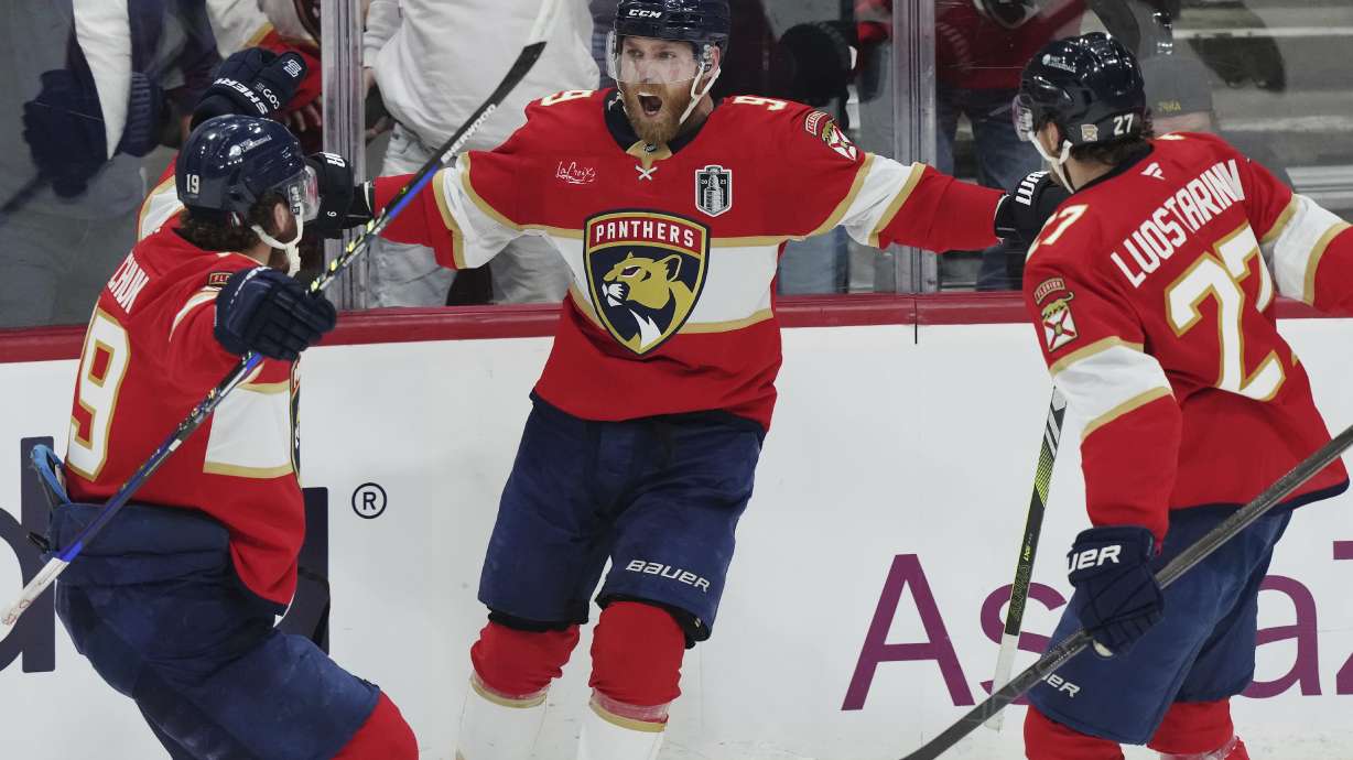 Florida Panthers' Sam Bennett (9) celebrates his goal against the Edmonton Oilers with Matthew Tkachuk (19) and Eetu Luostarinen (27) during the second period in Game 3 of the NHL hockey Stanley Cup finals in Sunrise, Fla., Monday, June 9, 2025.