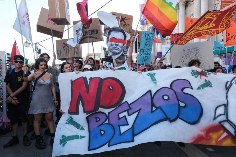 Demonstrators take part in a protest against Amazon founder Jeff Bezos in Venice, Italy, Saturday. Around 1,000 residents and activists participated, which highlighted grievances over tourism and inequality.