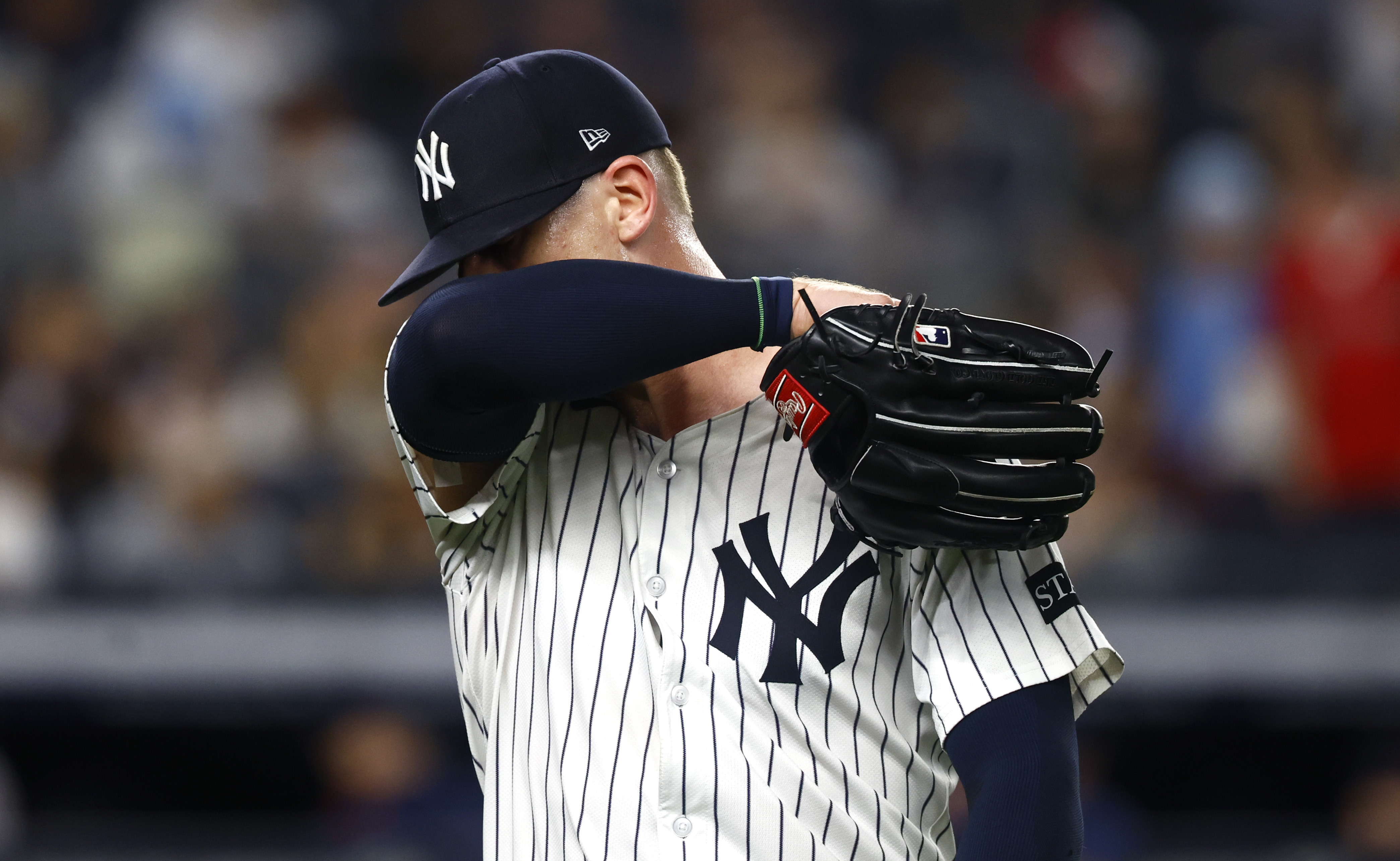 New York Yankees pitcher Ian Hamilton reacts on his way to the dugout during the ninth inning of a baseball game against the Boston Red Sox, Saturday, June 7, 2025, in New York. 
