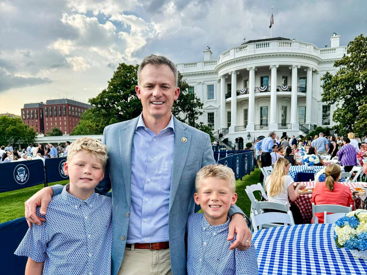 Rep. Blake Moore, R-Utah, and his children, Max, left, and George pose for a photo outside the White House.