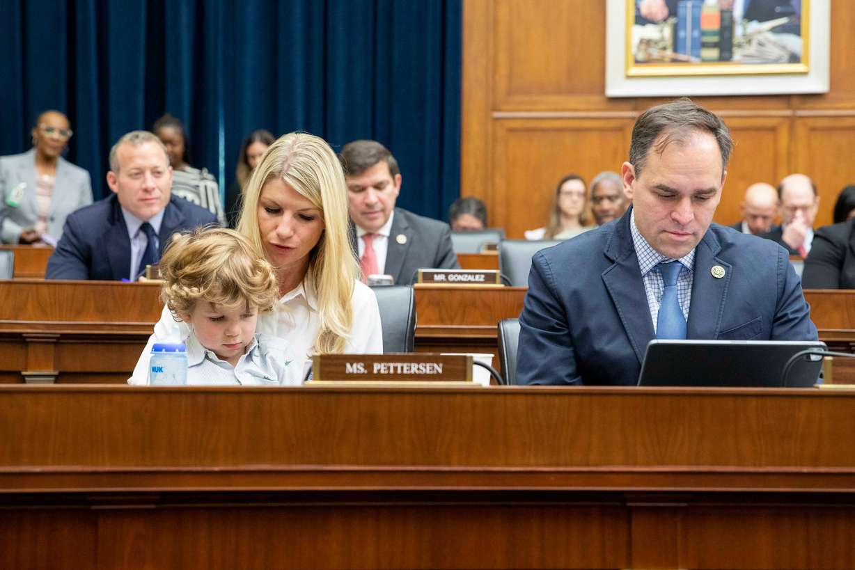 Rep. Brittany Pettersen, D-Colo., and her 3-year-old son Davis Silverii, sit next to Rep. Wiley Nickel, D-N.C., right, attend the House Financial Services Committee hearing regarding the state of the international financial system at the Capitol in Washington, June 13, 2023.