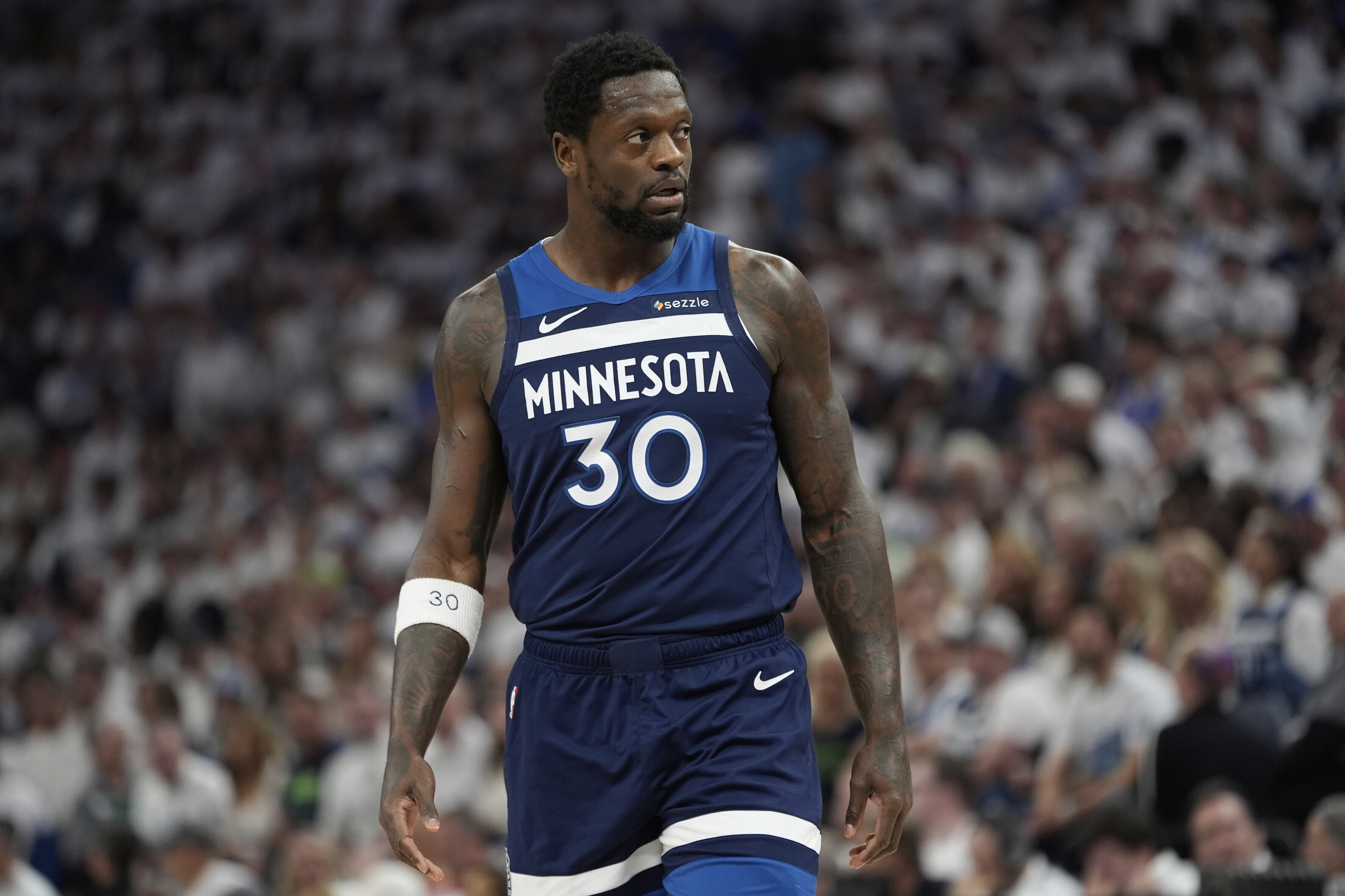 FILE - Minnesota Timberwolves forward Julius Randle stands on the court during the first half of Game 4 of an NBA basketball Western Conference Finals playoff series against the Oklahoma City Thunder, May 26, 2025, in Minneapolis. 