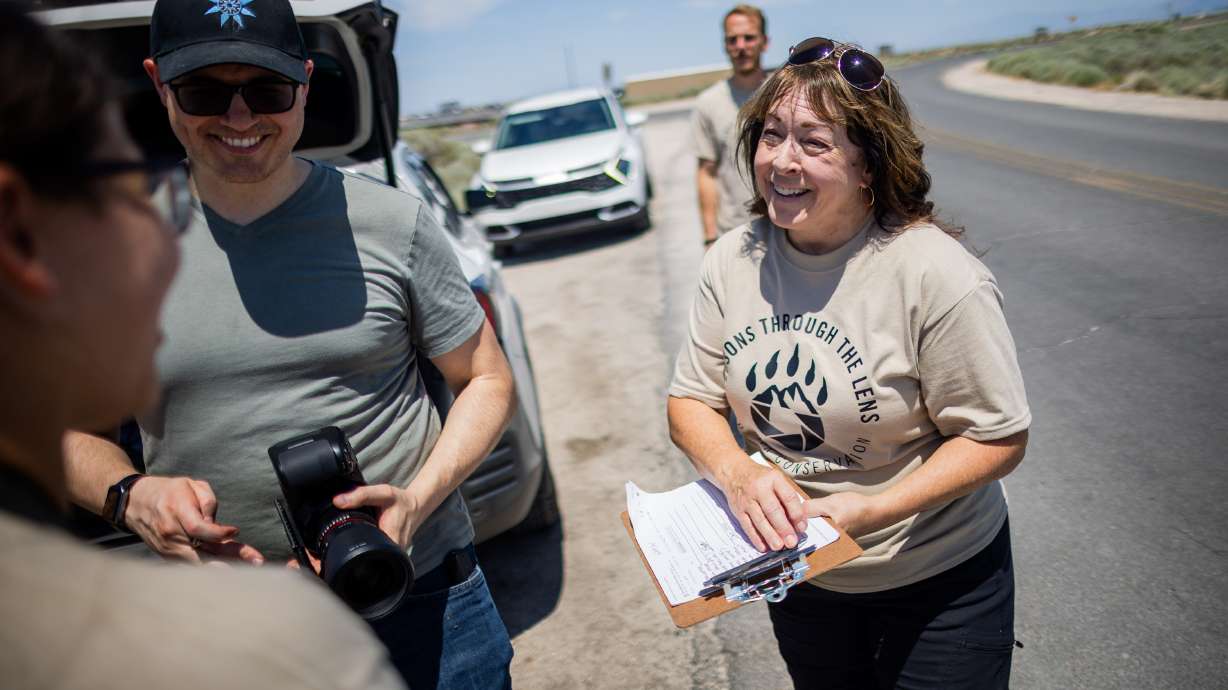 Mentor Shauna Hart, right, talks to students during “Lessons Through the Lens: Kids for Conservation,” a Utah Wildlife Federation summer photography camp over four Saturdays for youth ages 12–18 at Antelope Island State Park in Syracuse on Saturday.