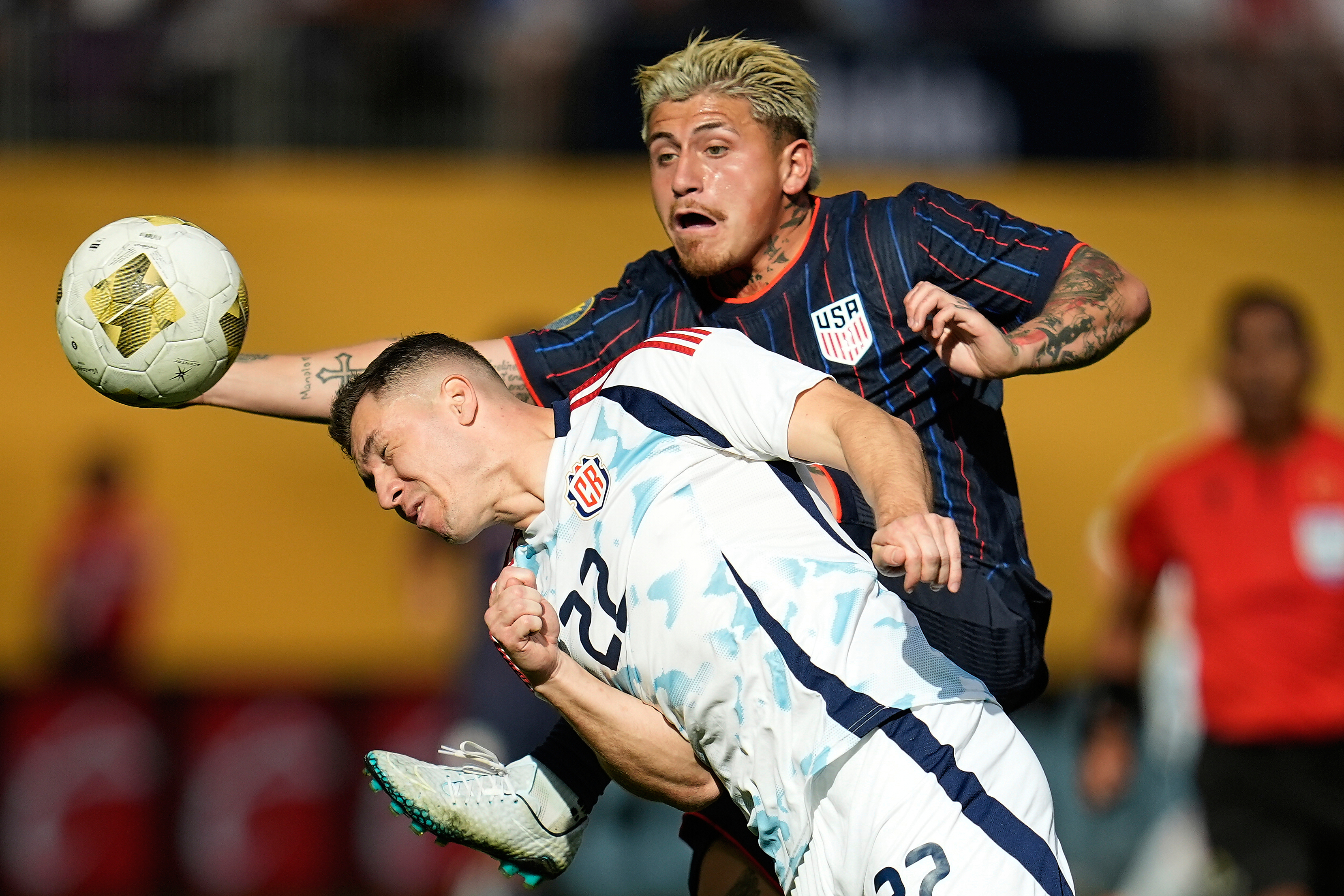Costa Rica midfielder Carlos Andrei Mora Montoya (22) and United States midfielder Diego Angel Luna, right, battle for possession of the ball during the first half of a CONCACAF Gold Cup quarterfinals soccer match Sunday, June 29, 2025, in Minneapolis.