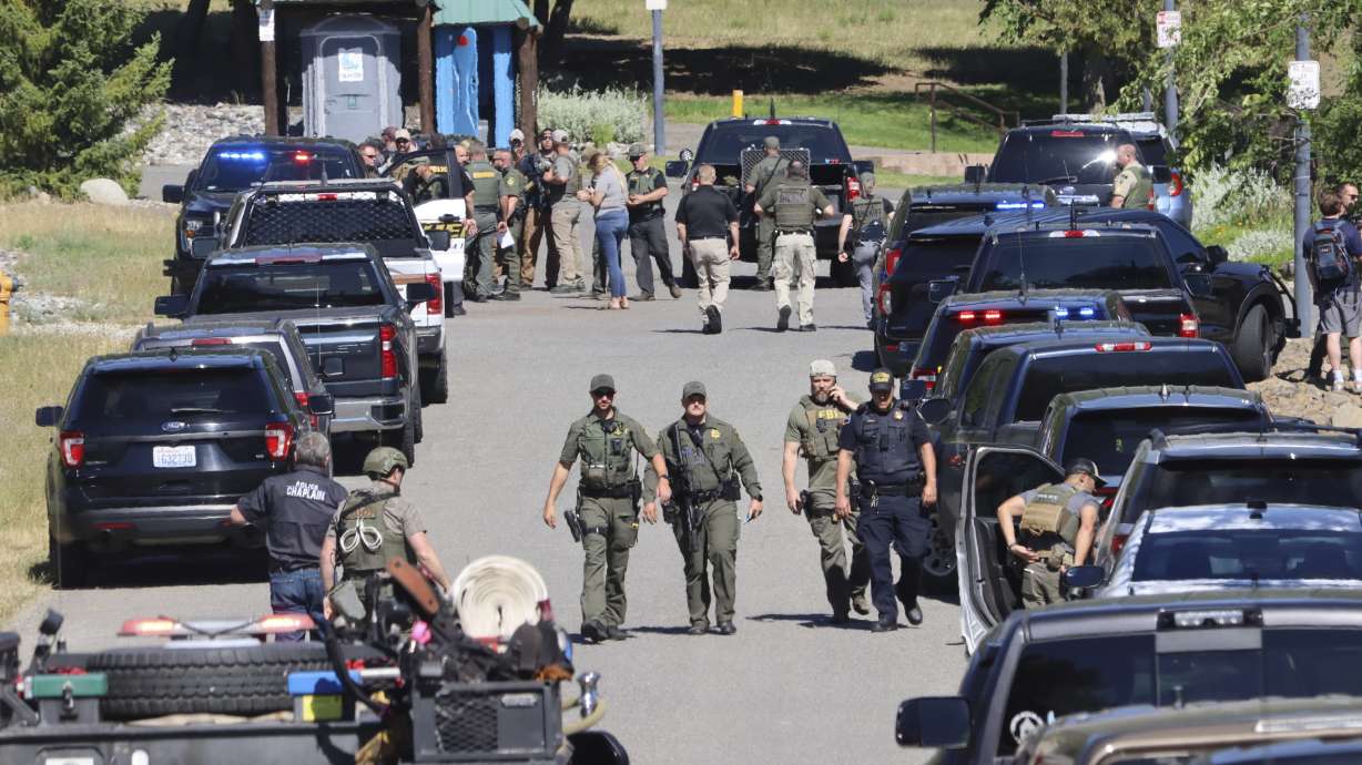 Law enforcement and emergency responders at Cherry Hill Park on Sunday afternoon following reports of an ambush shooting attack on Canfield Mountain, in Coeur d'Alene, Idaho.