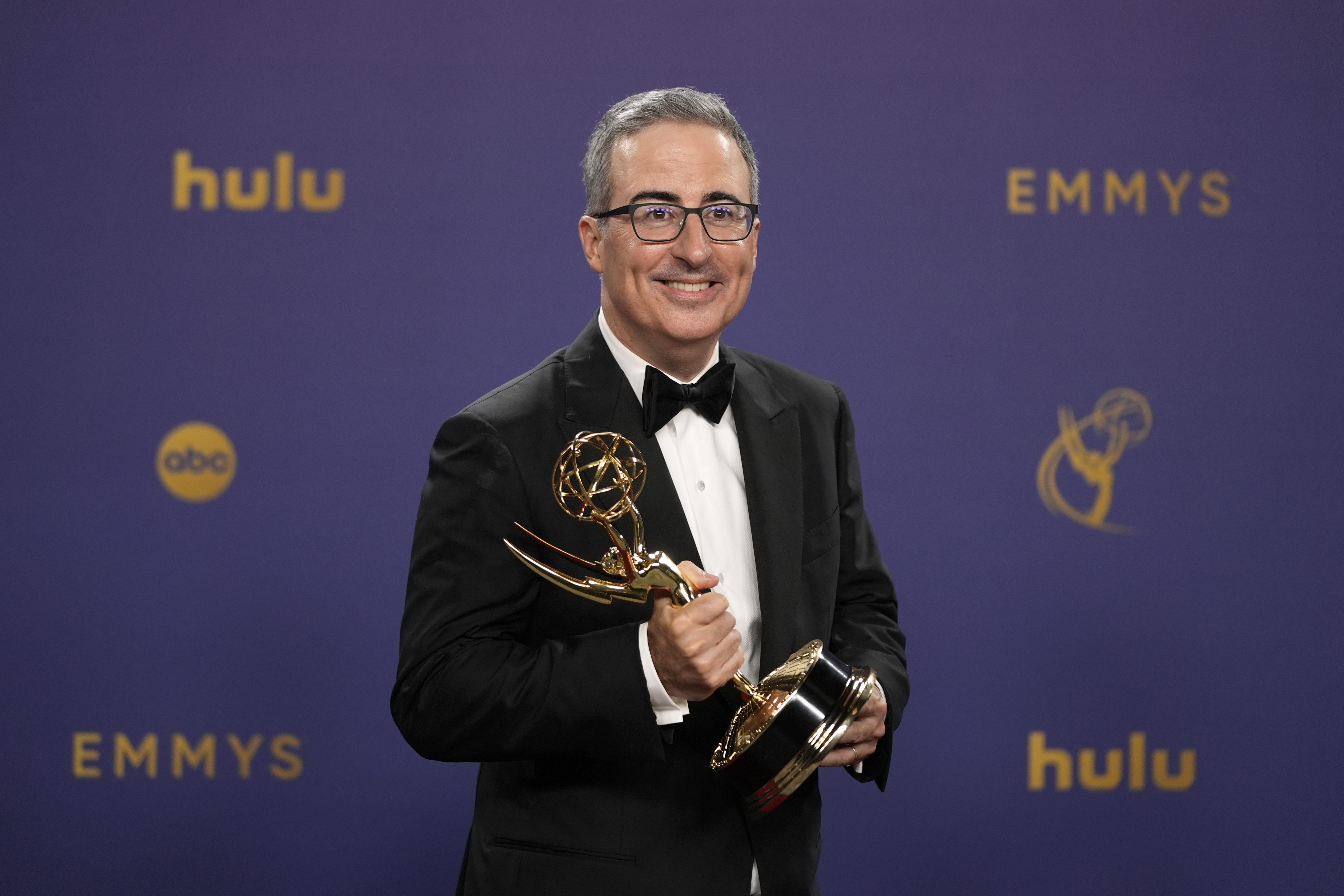 FILE - John Oliver poses in the press room with the award for outstanding scripted variety series for "Last Week Tonight With John Oliver" during the 76th Primetime Emmy Awards on Sunday, Sept. 15, 2024, at the Peacock Theater in Los Angeles.