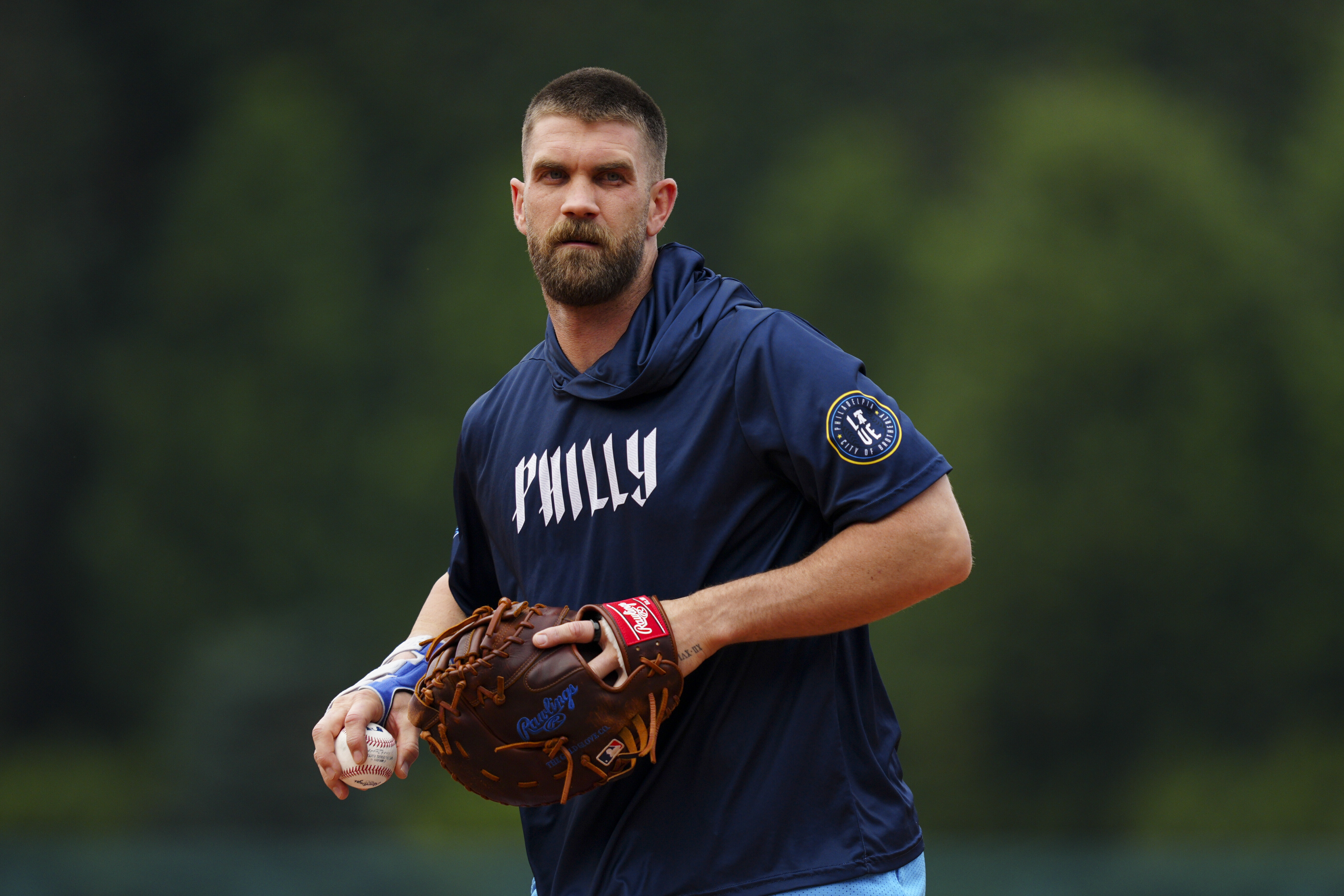 Philadelphia Phillies' Bryce Harper fields ground balls prior to a baseball game against the Toronto Blue Jays, Friday, June 13, 2025, in Philadelphia. 