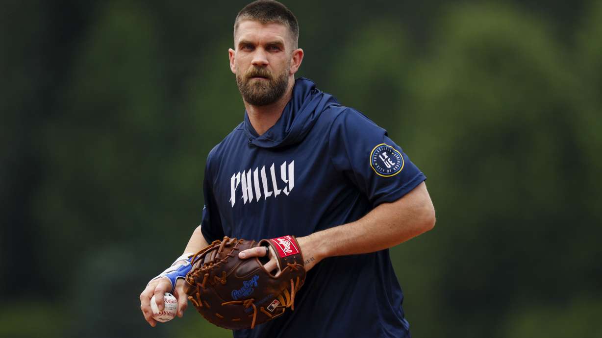 Philadelphia Phillies' Bryce Harper fields ground balls prior to a baseball game against the Toronto Blue Jays, Friday, June 13, 2025, in Philadelphia.