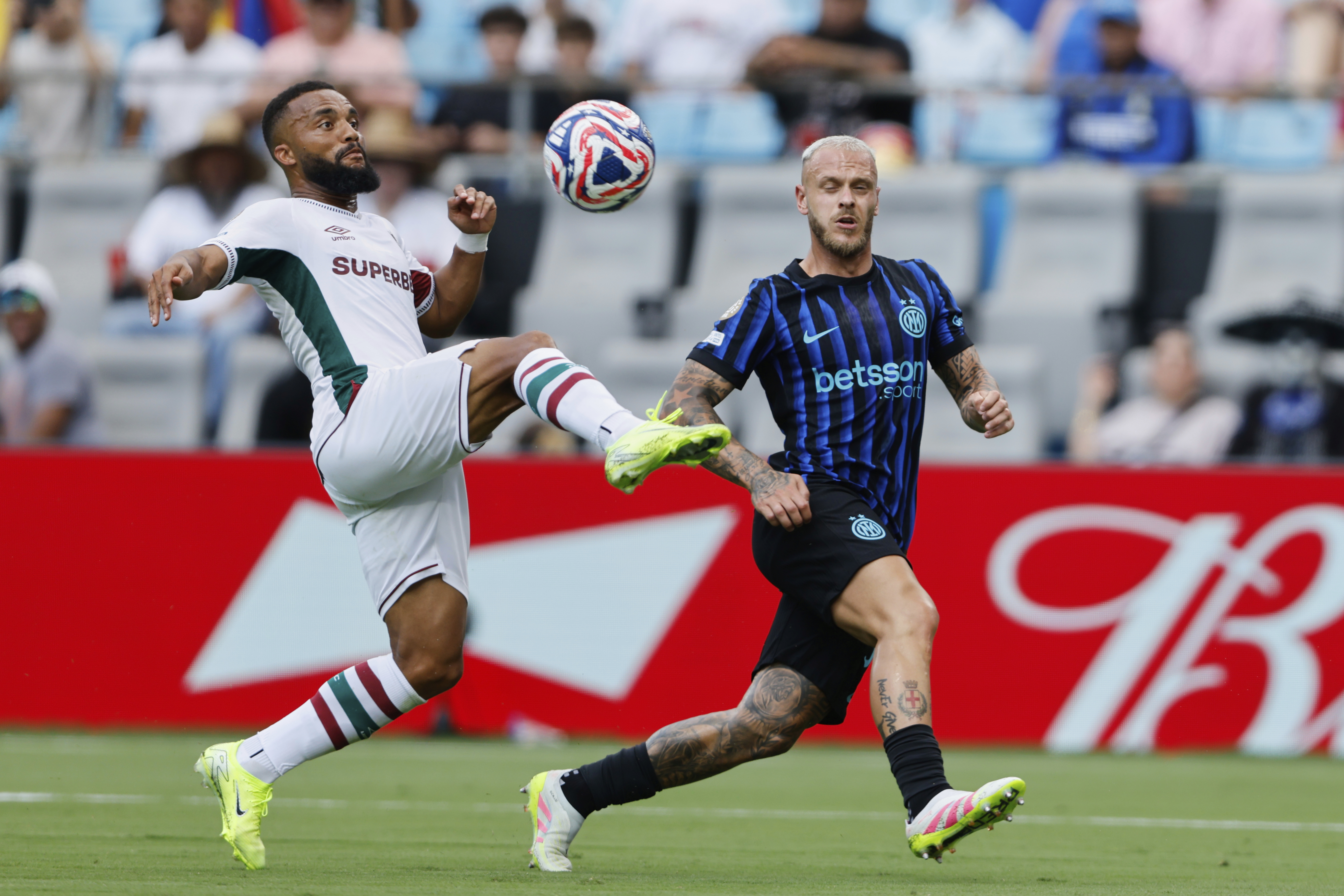 Fluminense's Samuel Xavier (2) plays the ball in front of Inter Milan's Federico Dimarco (32) during the Club World Cup round of 16 soccer match between Inter Milan and Fluminense in Charlotte, N.C., Monday, June 30, 2025.