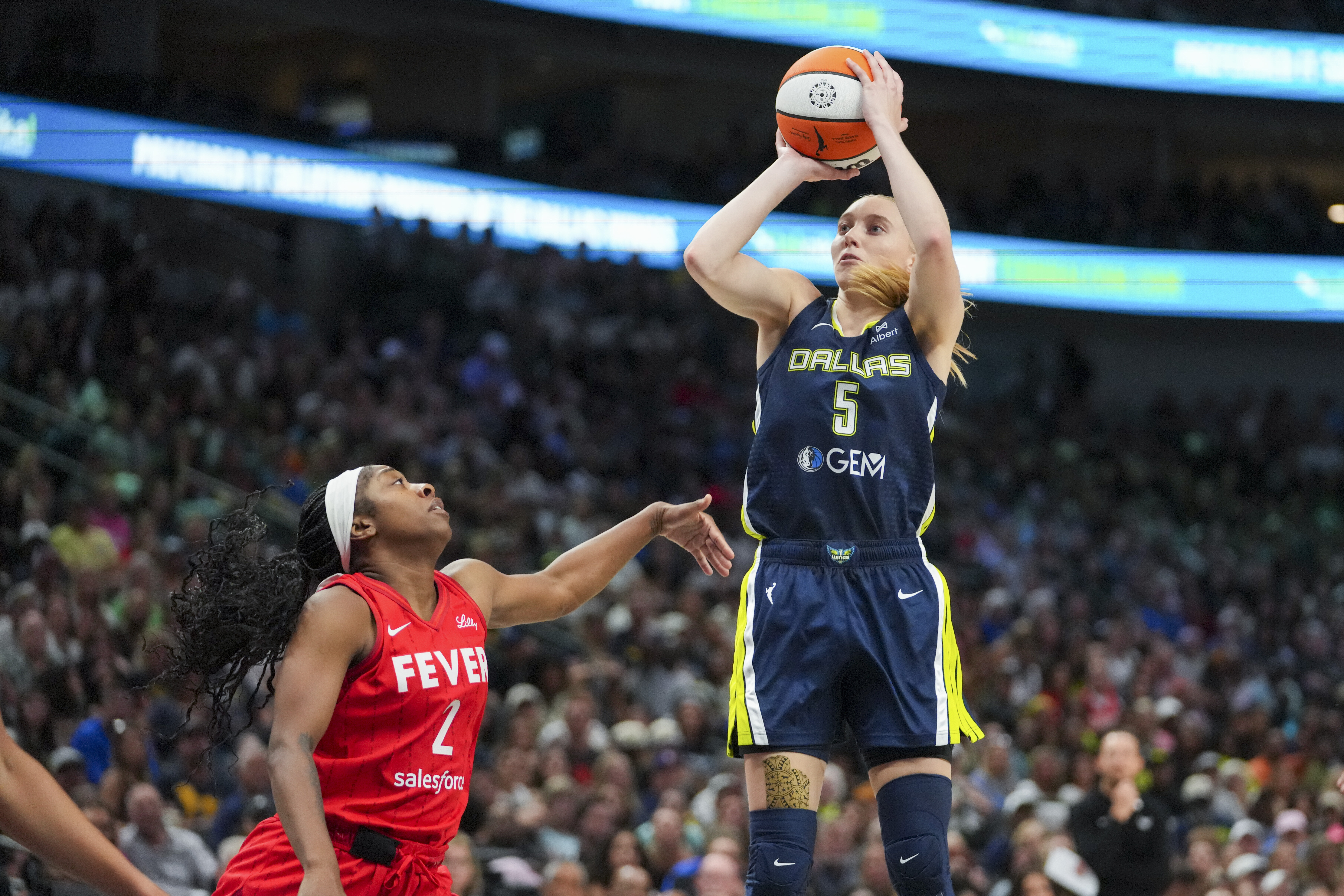Dallas Wings guard Paige Bueckers (5) shoots against Indiana Fever guard Aari McDonald (2) during the first half of a WNBA basketball game Friday, June 27, 2025, in Dallas. 