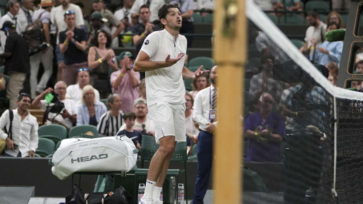 Taylor Fritz of the U.S. reacts after the first round men's single match against Giovanni Mpetshi Perricard of France was suspended at the Wimbledon Tennis Championships in London, Monday, June 30, 2025.
