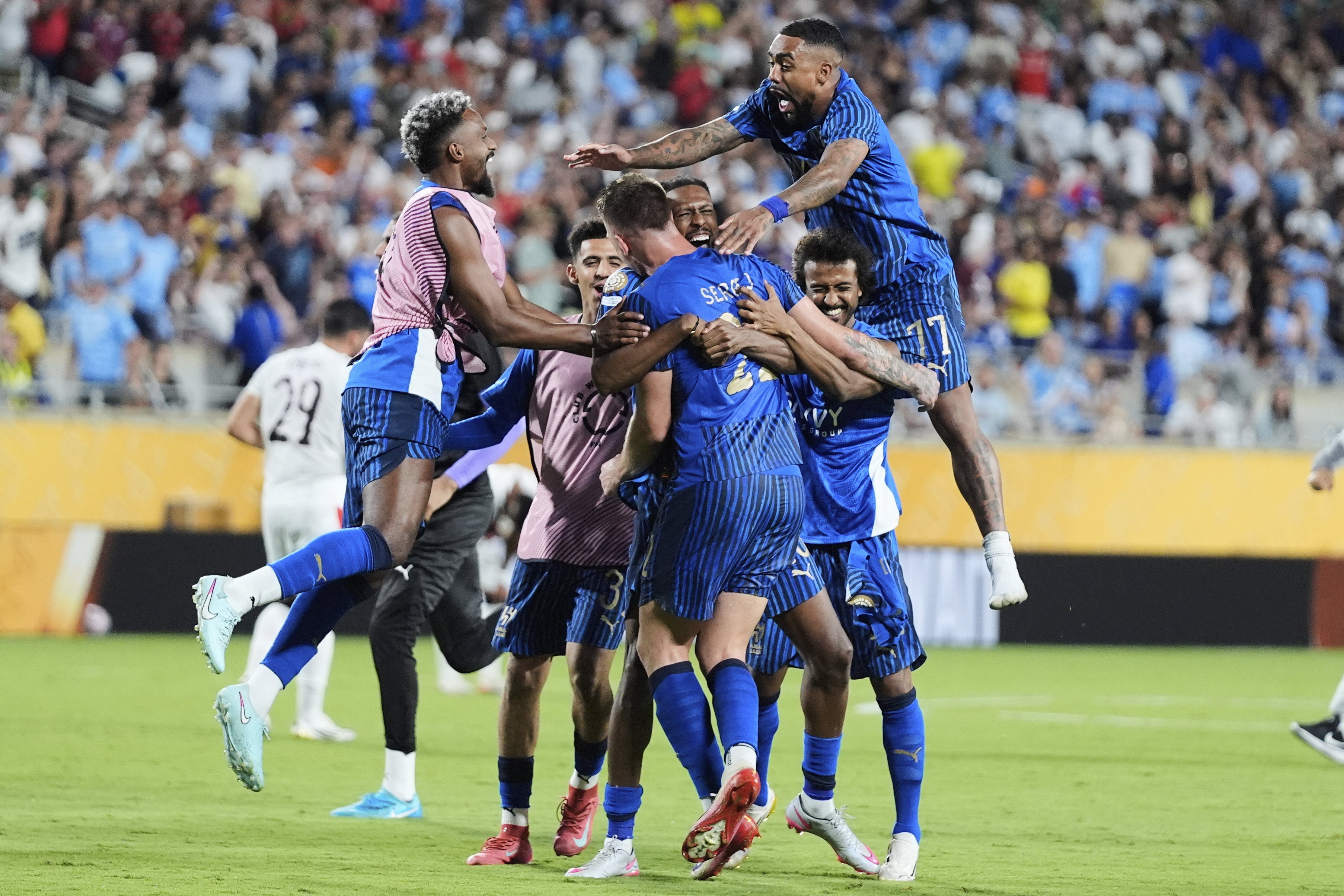 Al Hilal players celebrate following the Club World Cup round of 16 soccer match between Manchester City and Al Hilal in Orlando, Fla., Monday, June 30, 2025. 