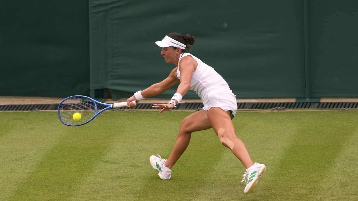 Jessica Pegula of the U.S. returns the ball to Elisabetta Cocciaretto of Italy during their women's first round singles match at the Wimbledon Tennis Championships in London, Tuesday, July 1, 2025.