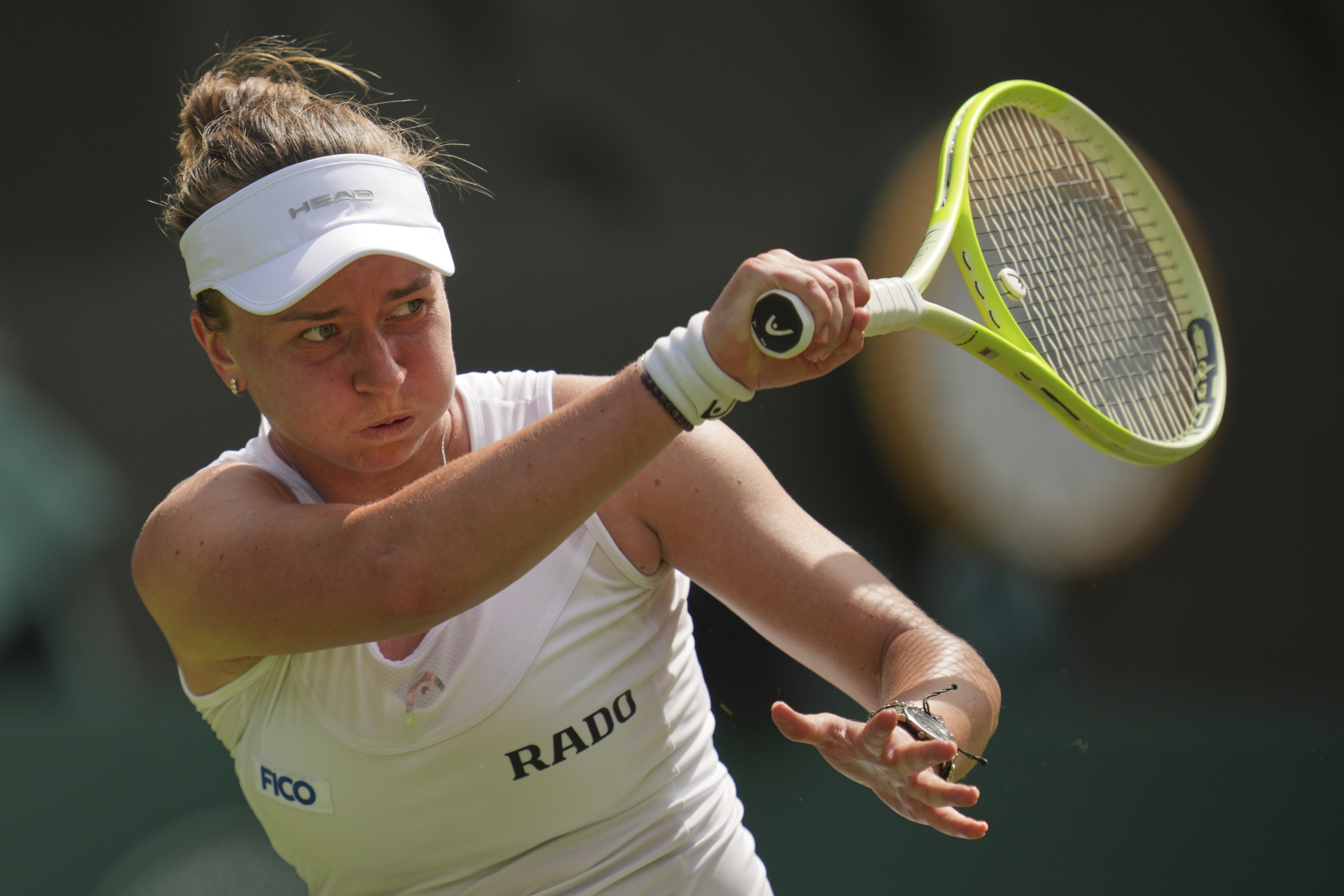Barbora Krejcikova of Czech Republic returns to Alexandra Eala of the Philippines during their first round women's singles match at the Wimbledon Tennis Championships in London, Tuesday, July 1, 2025. 