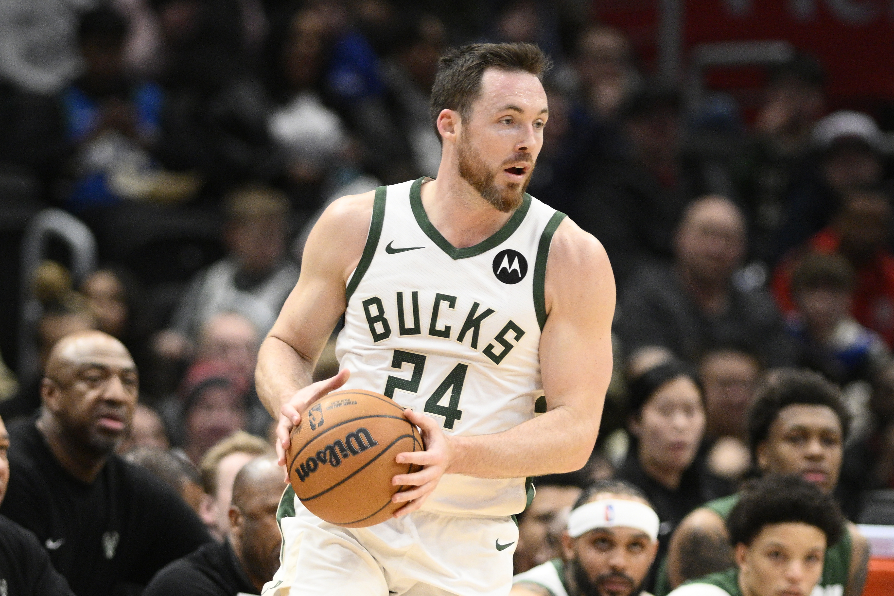 FILE - Milwaukee Bucks guard Pat Connaughton controls the ball during the first half of an NBA basketball game against the Washington Wizards, Feb. 21, 2025, in Washington.