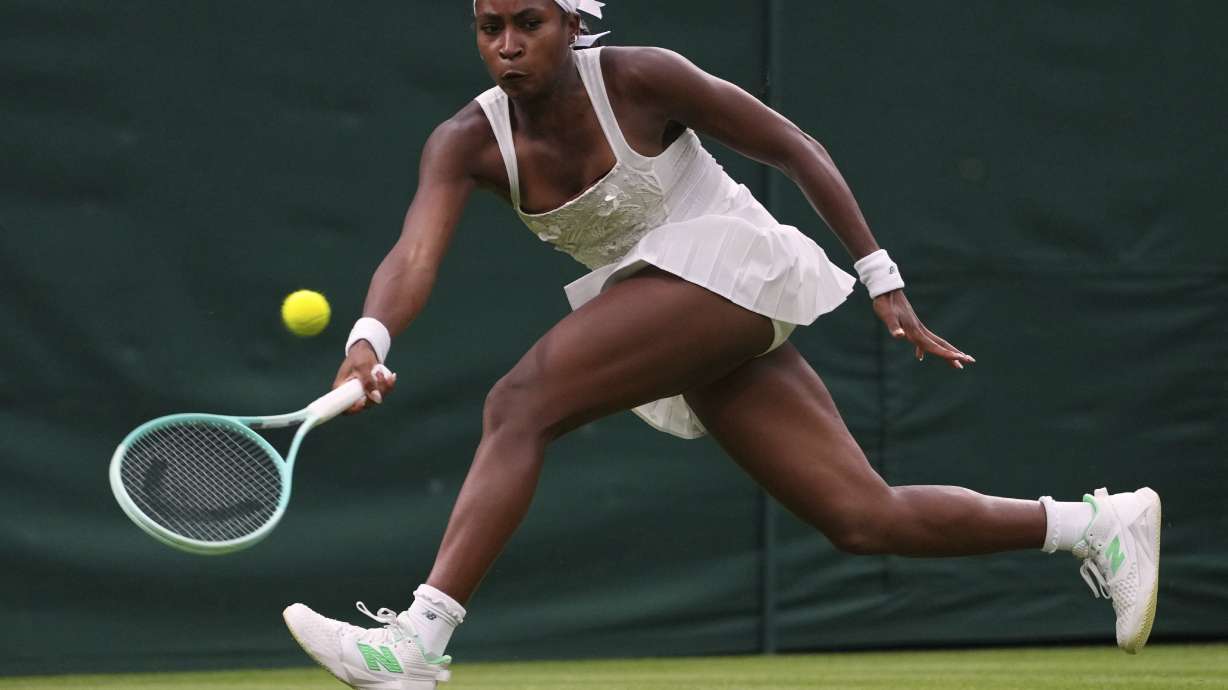 Coco Gauff of the U.S. returns the ball to Dayana Yastremska of Ukraine during their first round women's single match at the Wimbledon Tennis Championships in London, Tuesday, July 1, 2025.