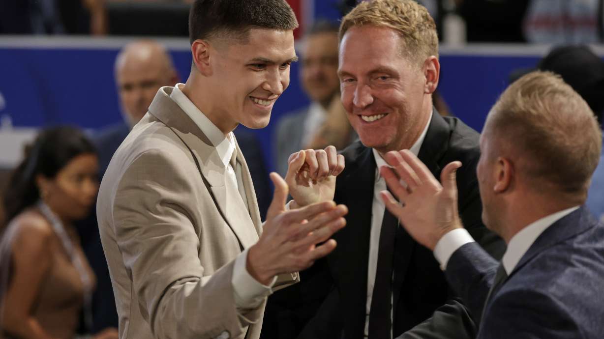 Egor Demin celebrates after being selected eighth by the Brooklyn Nets in the first round of the NBA basketball draft, Wednesday, June 25, 2025, in New York.