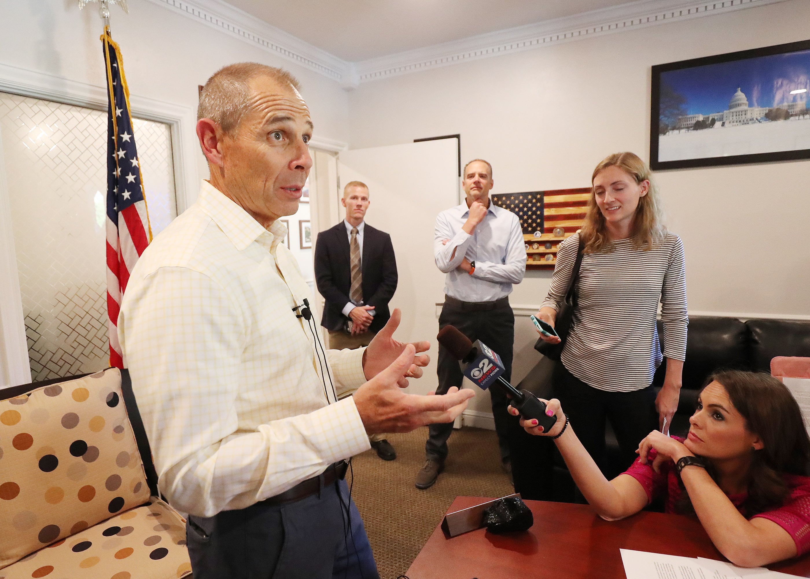 Rep. John Curtis, R-Utah, speaks with media in Provo on Sept. 21, 2018. Corey Norman, Curtis' deputy mayor, stands third from the right.