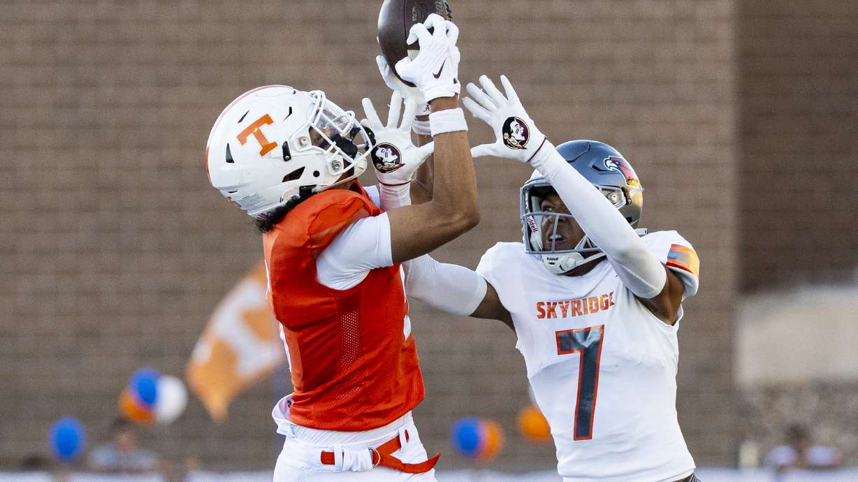 Timpview wide receiver Jaron Pula (5) makes a catch while guarded by Skyridge defensive back Jemaro Gilford (7) during a game held at Timpview High School in Provo on Thursday, Aug. 15, 2024.