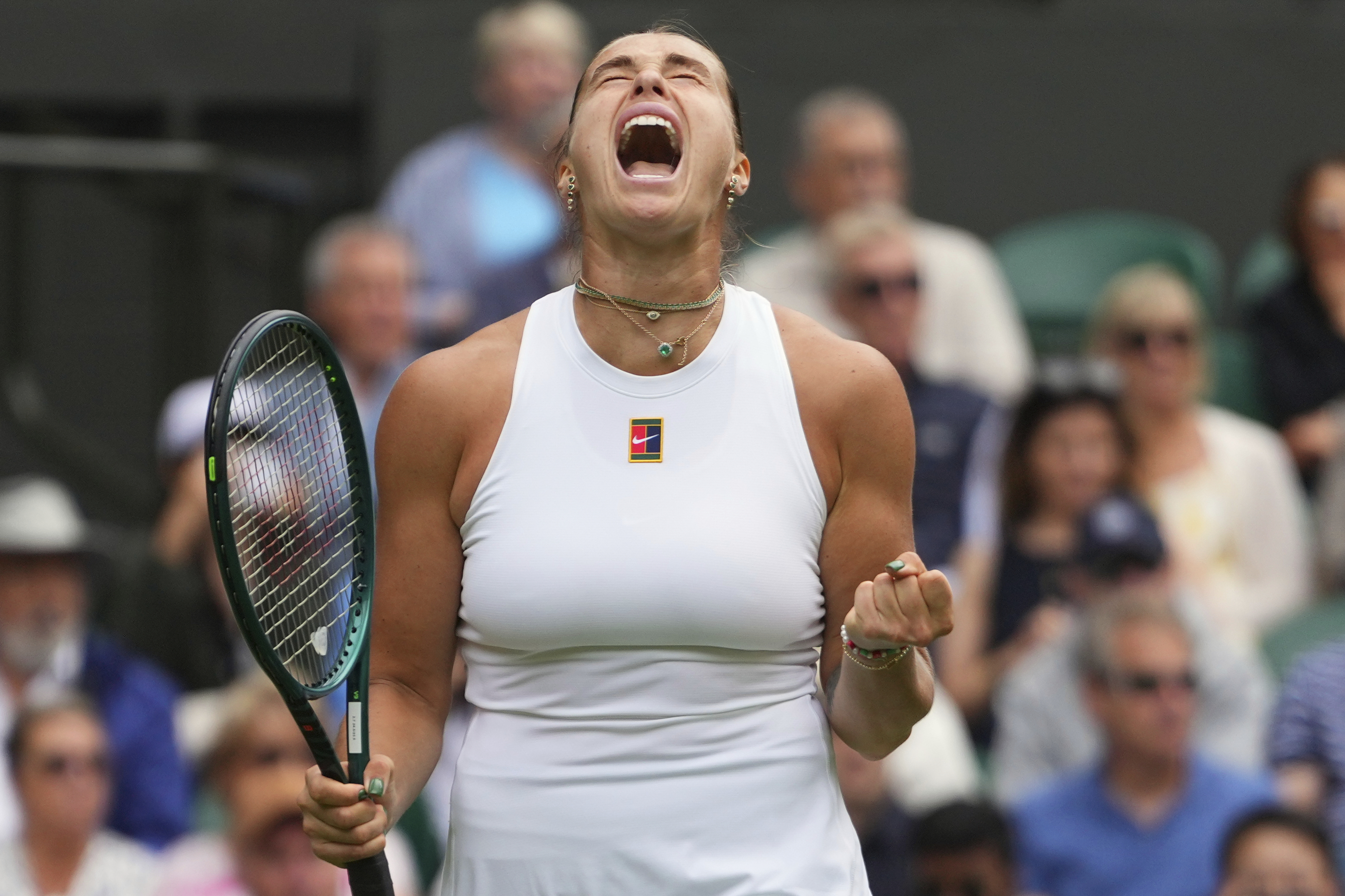 Aryna Sabalenka of Belarus reacts during her second round women's singles match against Marie Bouzkova of the Czech Republic at the Wimbledon Tennis Championships in London, Wednesday, July 2, 2025.