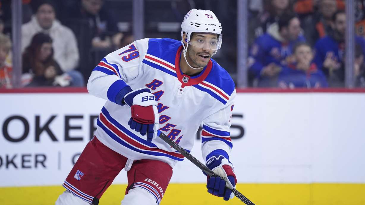 FILE - New York Rangers' K'Andre Miller plays in an NHL hockey game, Nov. 29, 2024, in Philadelphia.