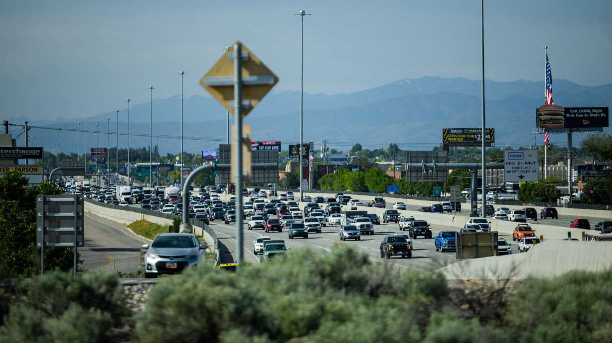Traffic moves along I-15 in Draper on May 23. Experts say Utah drivers might avoid issues at the pump this Labor Day weekend, but traffic could be a different story in some areas.