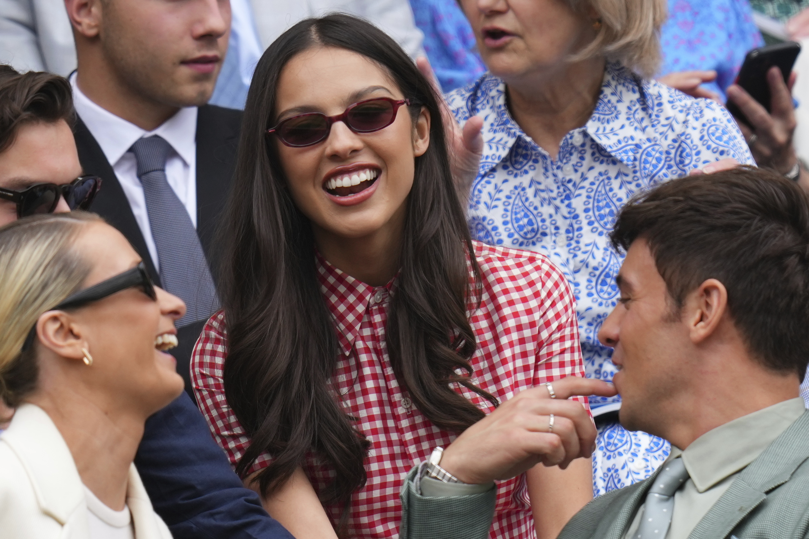 Singer Olivia Rodrigo smiles as she sits in the Royal Box at Centre Court during the Wimbledon Tennis Championships in London, Wednesday, July 2, 2025.