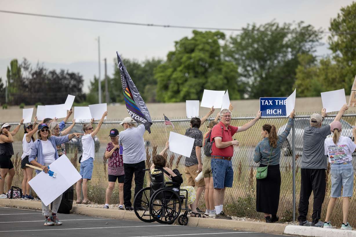 People rally outside Utah Rep. Celeste Maloy's Bountiful office in hopes of having her vote “no” to President Donald Trump’s budget bill on Wednesday.