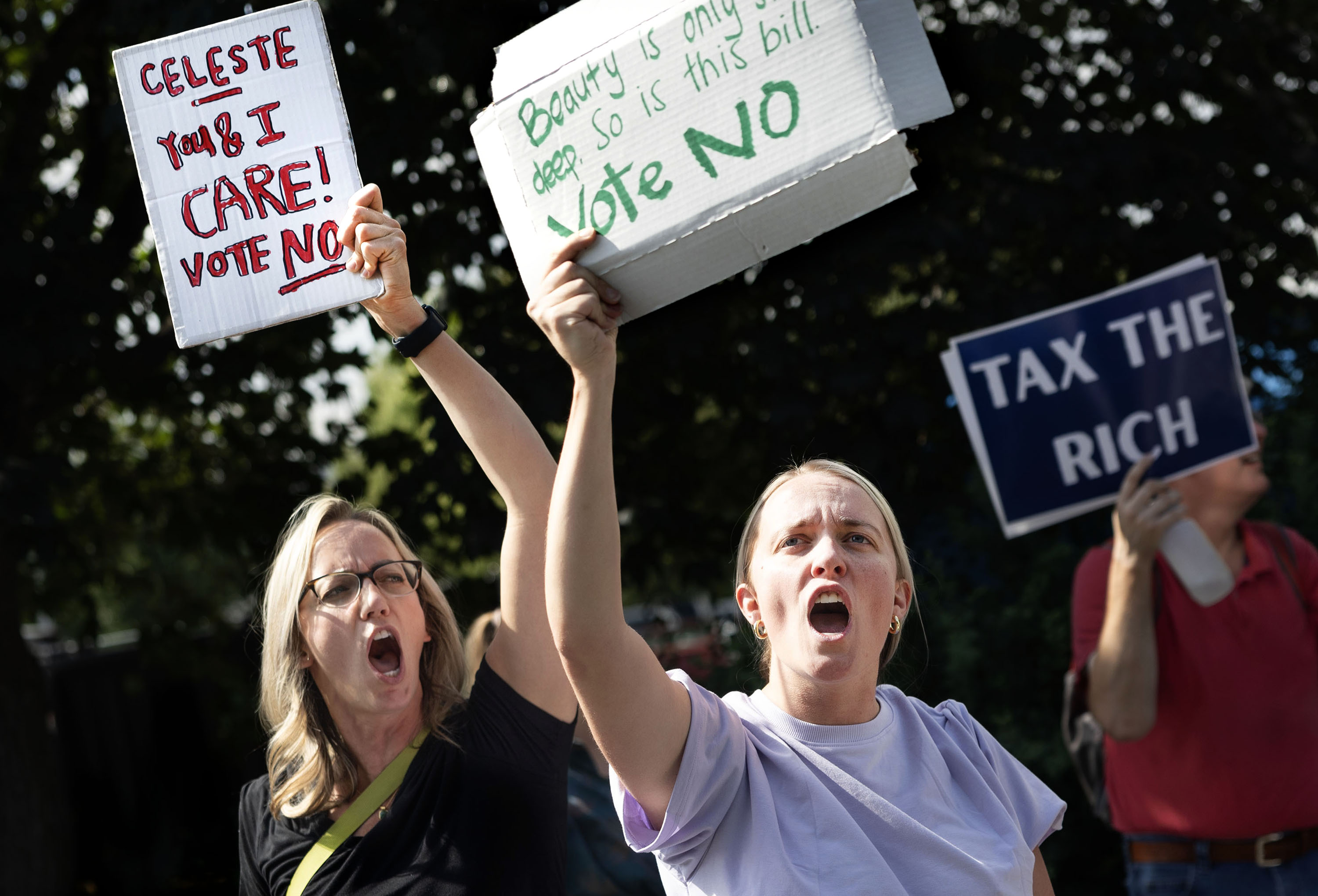 Michelle Monson and Miranda Montgomery rally outside Utah Rep. Celeste Maloy's Bountiful office in hopes of having her vote “no” to President Donald Trump’s budget bill on Wednesday.