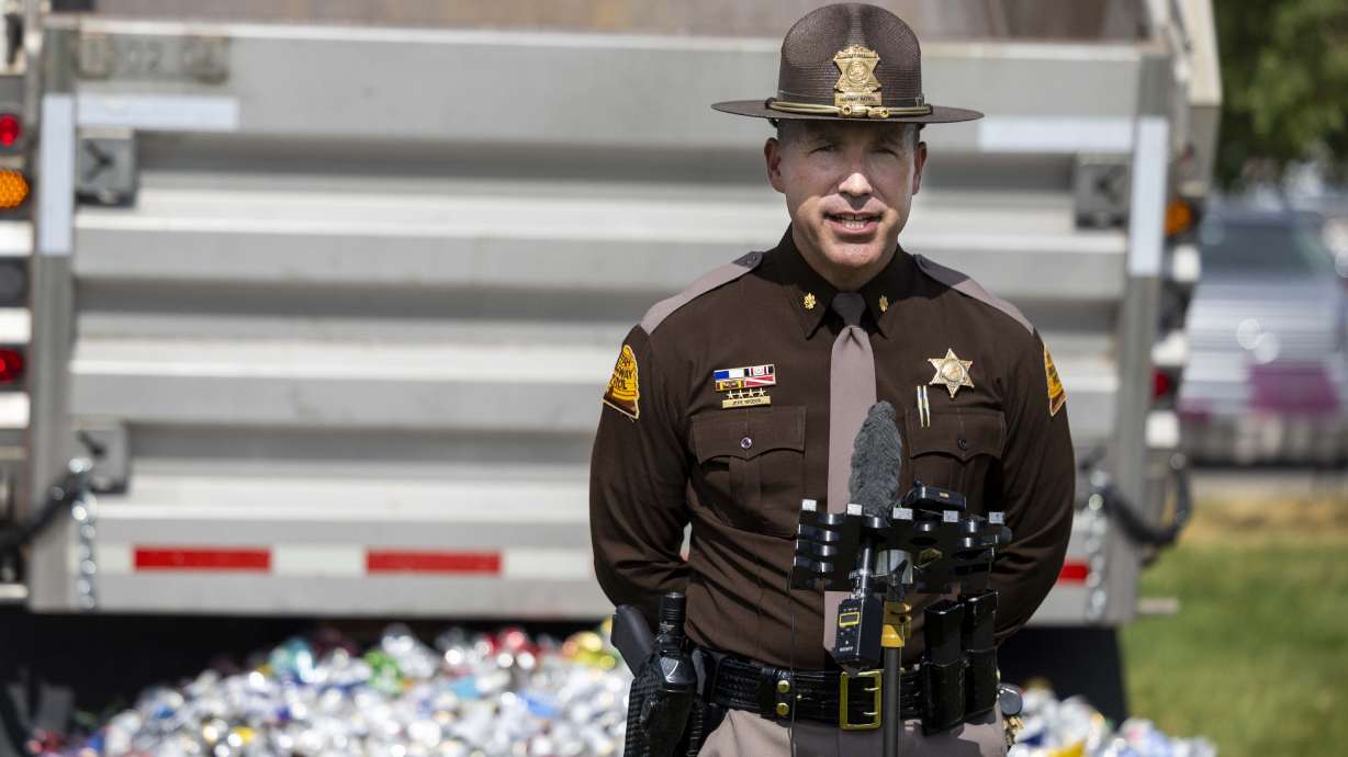 UHP Maj. Jeff Nigbur speaks at an event commemorating the more than 11,000 DUI arrests made in 2024, which featured 11,440 aluminum cans, in Taylorsville on Wednesday.