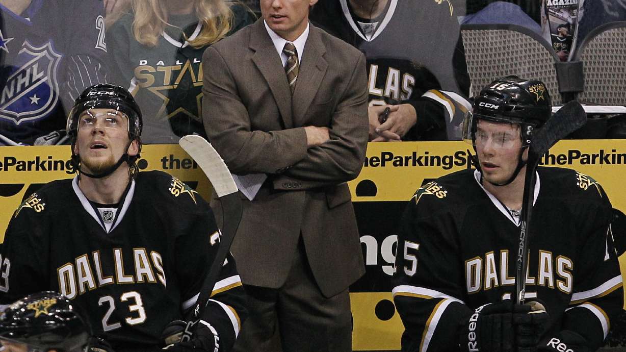 FILE - Dallas Stars head coach Glen Gulutzan, center, during the first period of an NHL Hockey game against the St. Louis Blues, April 7, 2012, in Dallas.